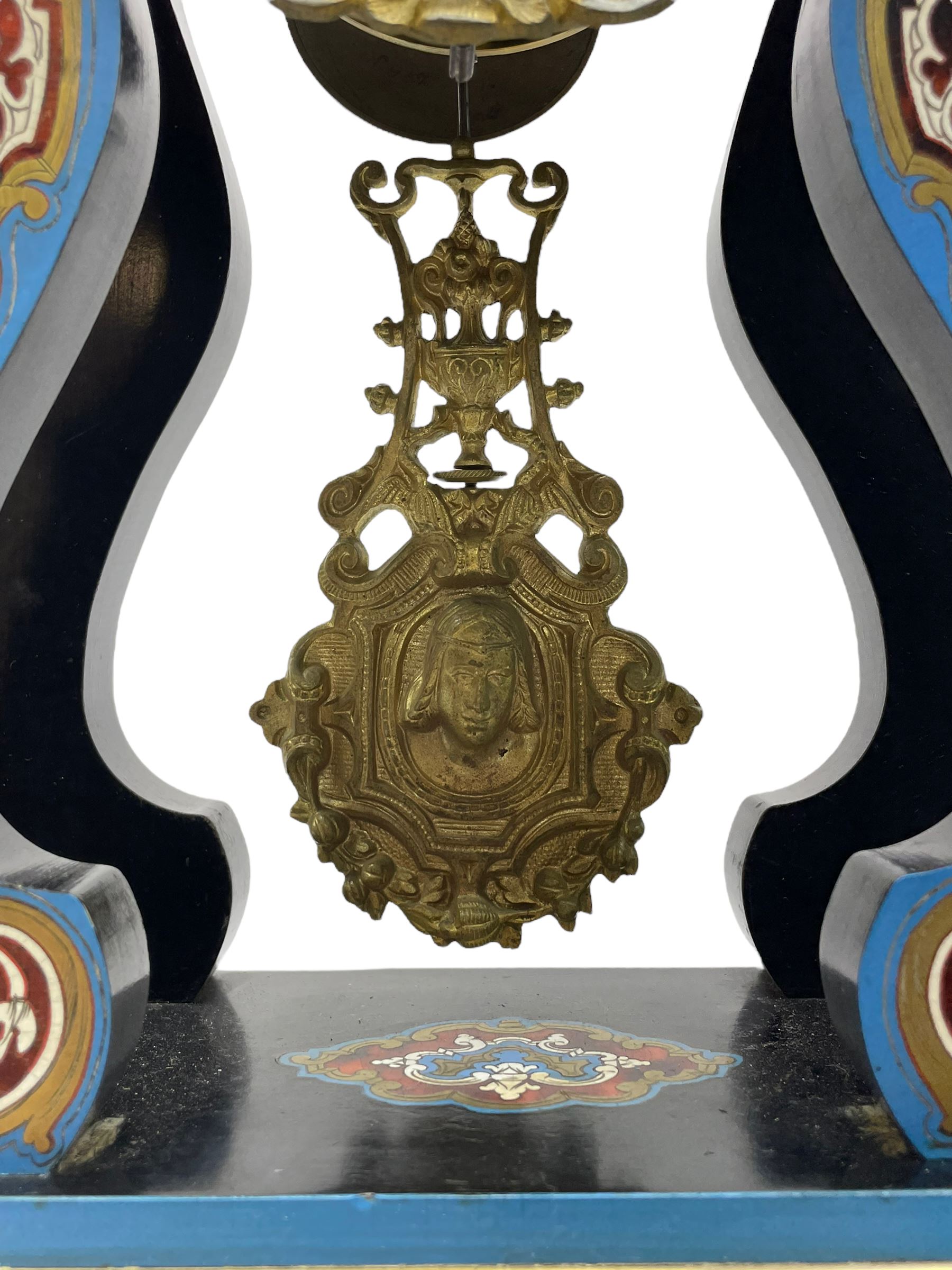Breguet A Paris - Mid-19th century 8-day French portico clock, ebonised case with brass and cloisonne inlay, on a rectangular plinth with a shaped base, white enamel dial with blue Roman numerals, minute track and steel trefoil hands, cast brass bezel with scroll and foliate decoration and a conforming gridiron pendulum, twin train going barrel movement with a countwheel strike sounding the hours and half-hours on a bell, with an ebonised base and glass dome. 