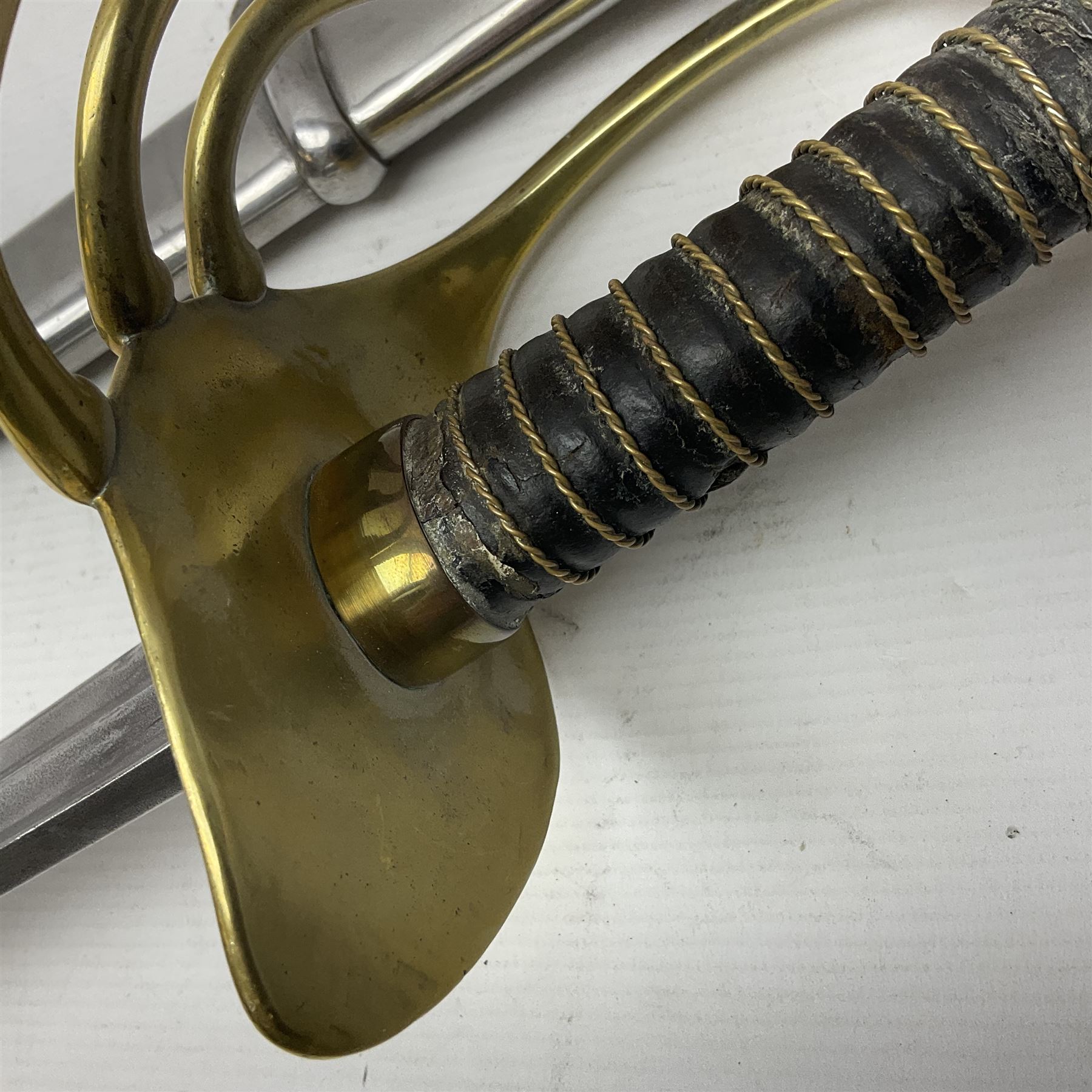 Early 19c French 1st Empire Heavy Cavalry trooper's sword, the 95.5cm double fullered blade with various stamped marks and inscribed Klingenthal 1814 to the back edge, four-bar brass hilt with wire-bound leather grip, knucklebow numbered 139; in polished steel scabbard with two suspension rings L117cm overall