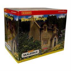 Ten Hornby '00' gauge Skaledale buildings, comprising two R8744 Straight Walls, R8564 Model Shop, R9768 The Pharmacy, R8501 Raven Cottage, R8515 Clovelly Cottage, R8626 Country Fire Station, R8588 Weighbridge & Scales, R8638 Platform & Shelter and R9763 Off Your Head Barbers Shop, all boxed
