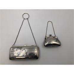 Early 20th century silver mounted coin purse, with leather interior and finger chain, hallmarked Samuel M Levi, Birmingham 1917, together with a similar Edwardian example, with engraved initials and engine turned decoration, hallmarked Birmingham 1907, maker's mark worn and indistinct, largest W11.3cm