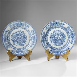 Pair of Chinese Kangxi period blue and white plates, painted in underglaze blue, decorated...