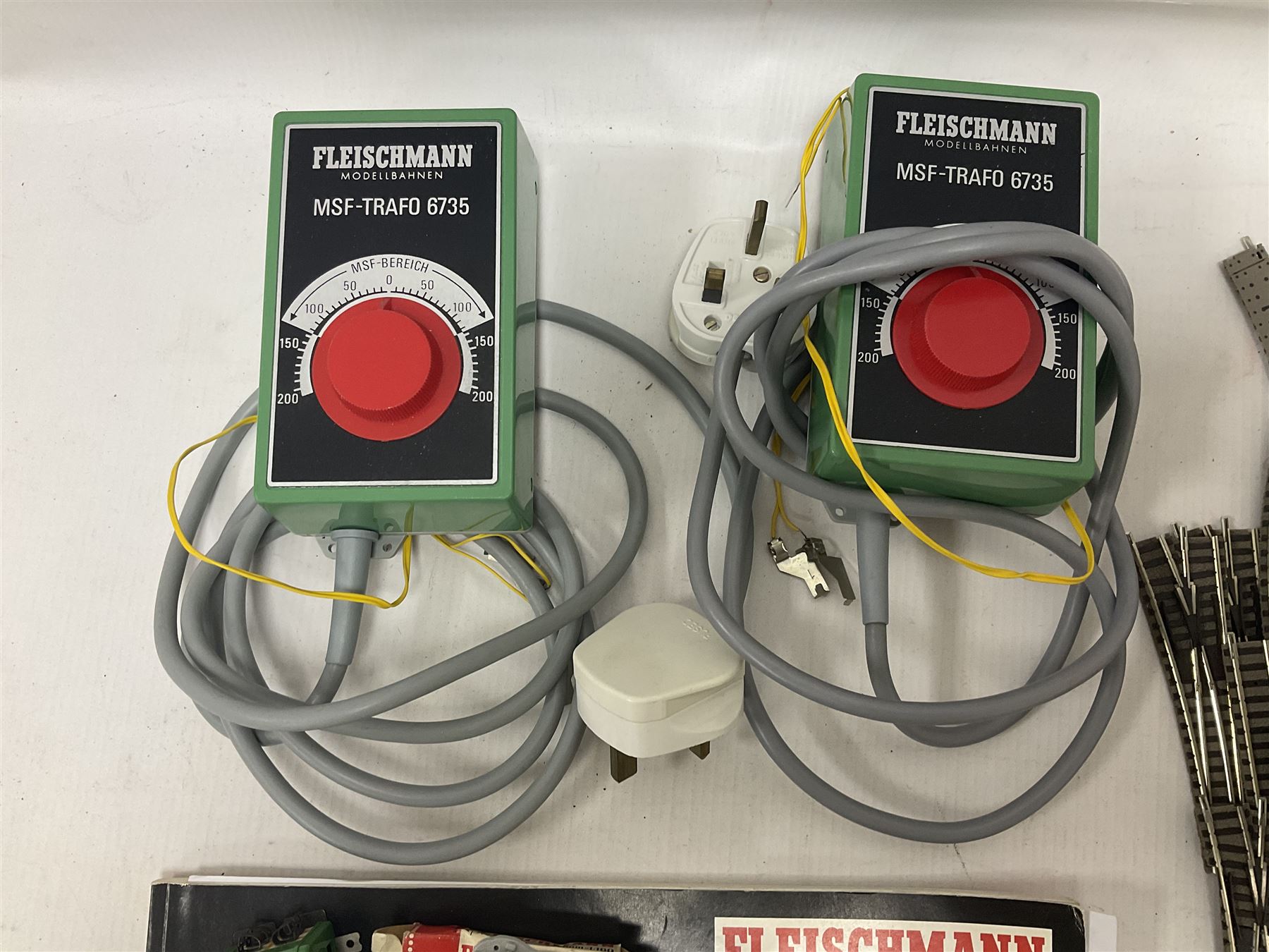 Fleischmann ‘N’ gauge - quantity of track, couplings, switches and accessories to include no.9481 Dump Car Unloader, two transformers and a mid 1980s Fleischmann catalogue 