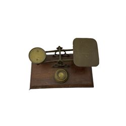 Brass postal scales with rates displayed and three weights