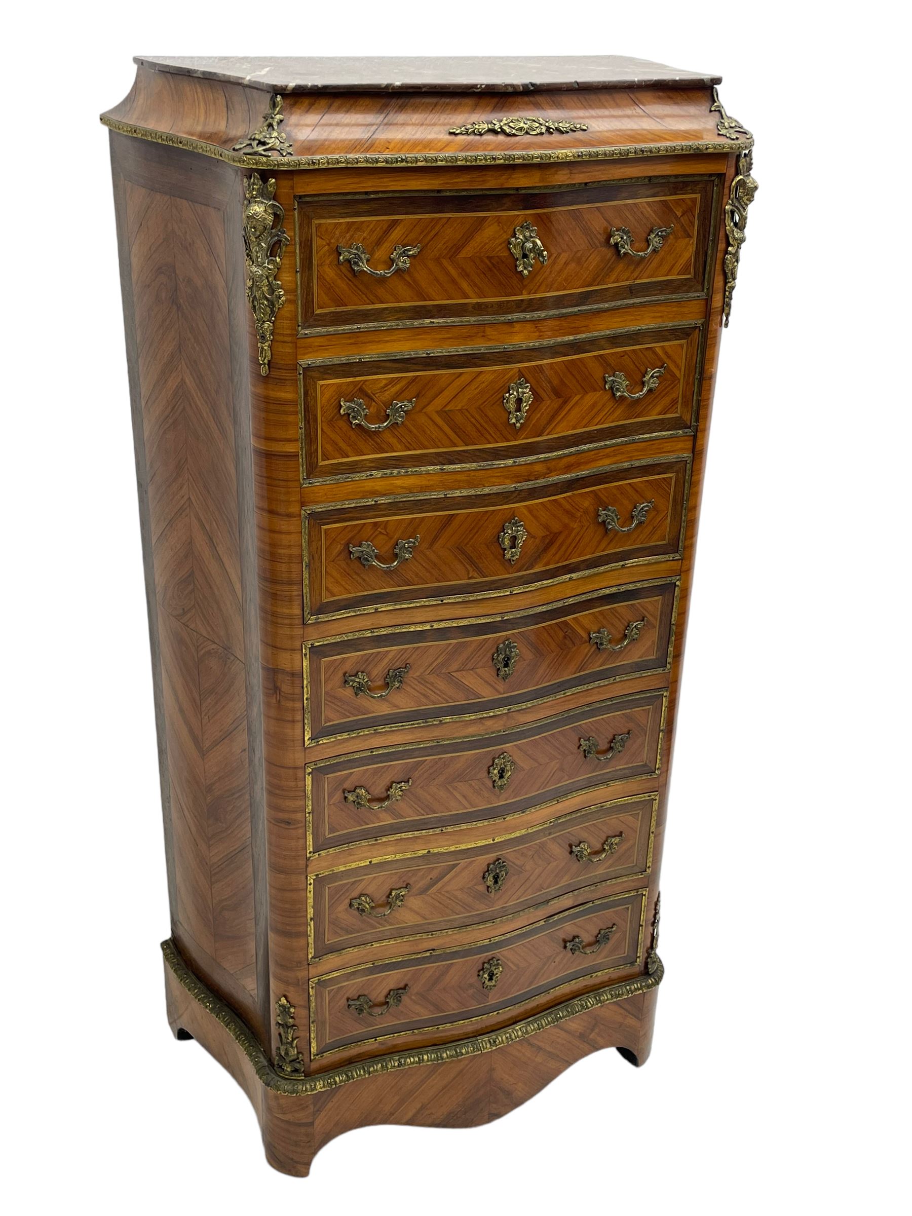 Mid-20th century Louis XVI design Kingwood and walnut secretaire à Abattant, shaped serpentine form with dark rouge variegated marble top, the fall front disguised as three drawers enclosing birdseye maple interior with shelf, drawers and writing surface, four functioning drawers below, decorated with cast gilt metal mouldings and mask cartouches, on skirted base with egg and dart moulded gilt metal edge