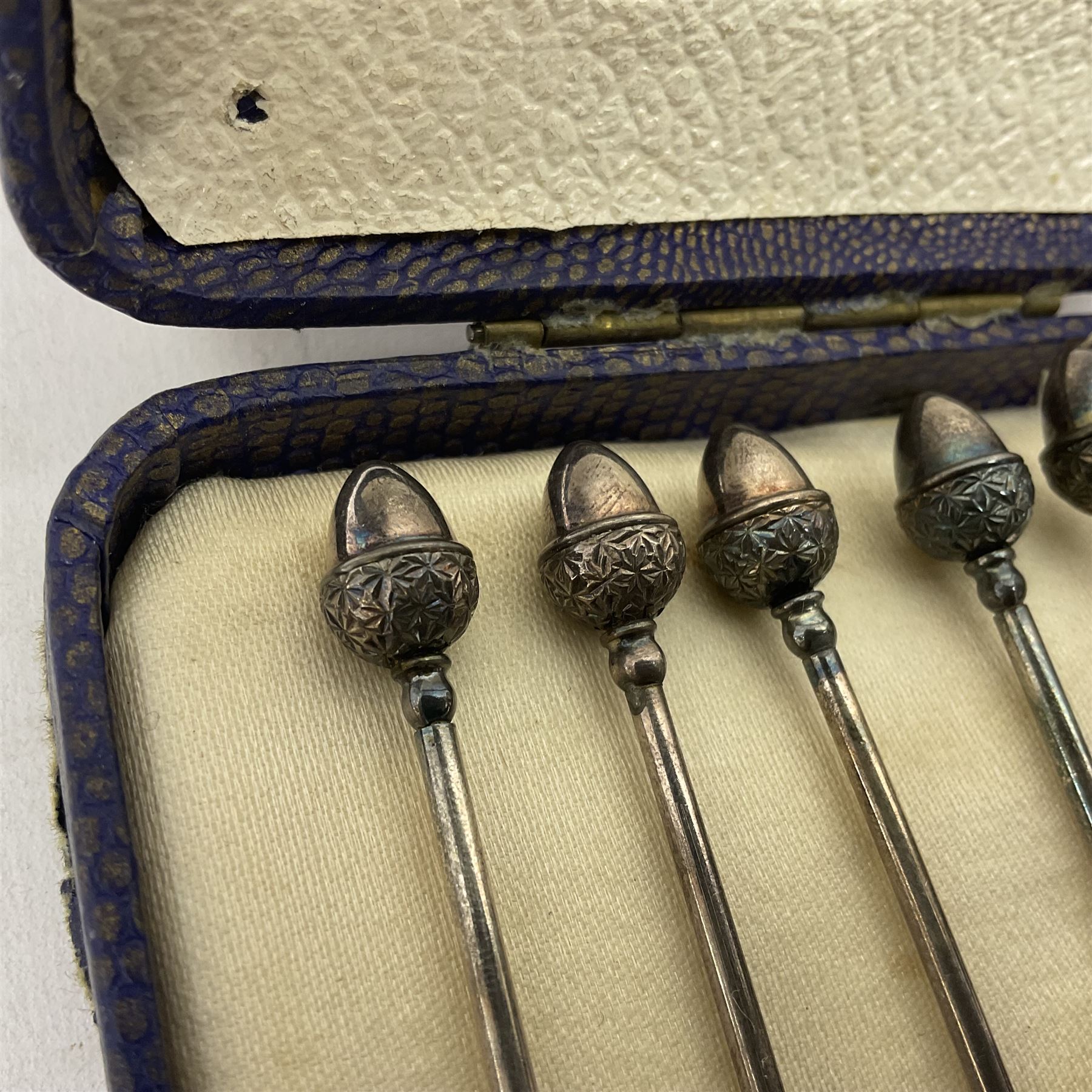 Set of six silver plated cocktail sticks, with acorn finials, hallmarked silver christening cup, silver ring and earrings and a costume jewellery cameo bracelet 