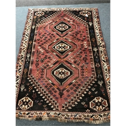 Shiraz red ground rug, three central medallions, 254cm x 177cm