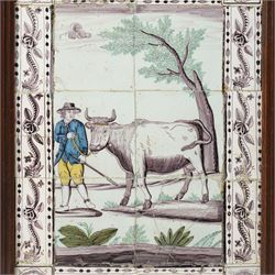 Late 18th/ early 19th century Dutch delftware tile picture of a rural scene with a farmer leading a cow within a floral surround, framed 62cm x 49cm overall