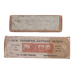 Collection of 9.5mm and 16mm cine film reels, mostly silent black and white with some notched examples, including 'Antarctic Whale Hunt' with sound, 'White Flame', 'The Good Old Days' electricity promotional, 'Rolling Around' Charlie Chaplin, etc, most in tin cases with hand written titles, together with two boxed sets of lantern slides, 'The Transvaal War', 'The Sweep & The Whitewasher' and 'Willies Revenge'