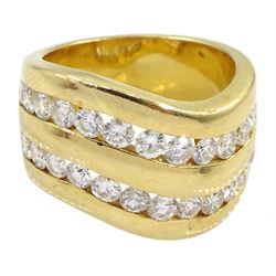 18ct gold two row channel set diamond ring, each row consisting of twelve round brilliant cut diamonds, stamped 750