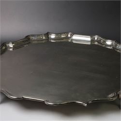 Early 20th century large silver salver, of circular form with Chippendale style rim, upon four hoof feet, hallmarked Elkington & Co Ltd, Birmingham 1918, D47cm