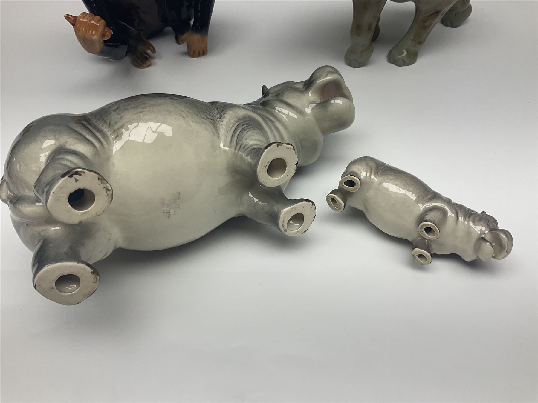Large Sylvac monkey together with three smaller monkeys, together with Beswick Pigeon no 1383, Melba Ware hippo and baby and Royal Dux elephant 