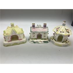 Twelve Coalport bone china pastille burner cottages, to include Fortune Towers, Summer Palace, The Vinery, Springtime Cottage, Dream Villa, Half Moon House, etc, all with original boxes and some with certificates 