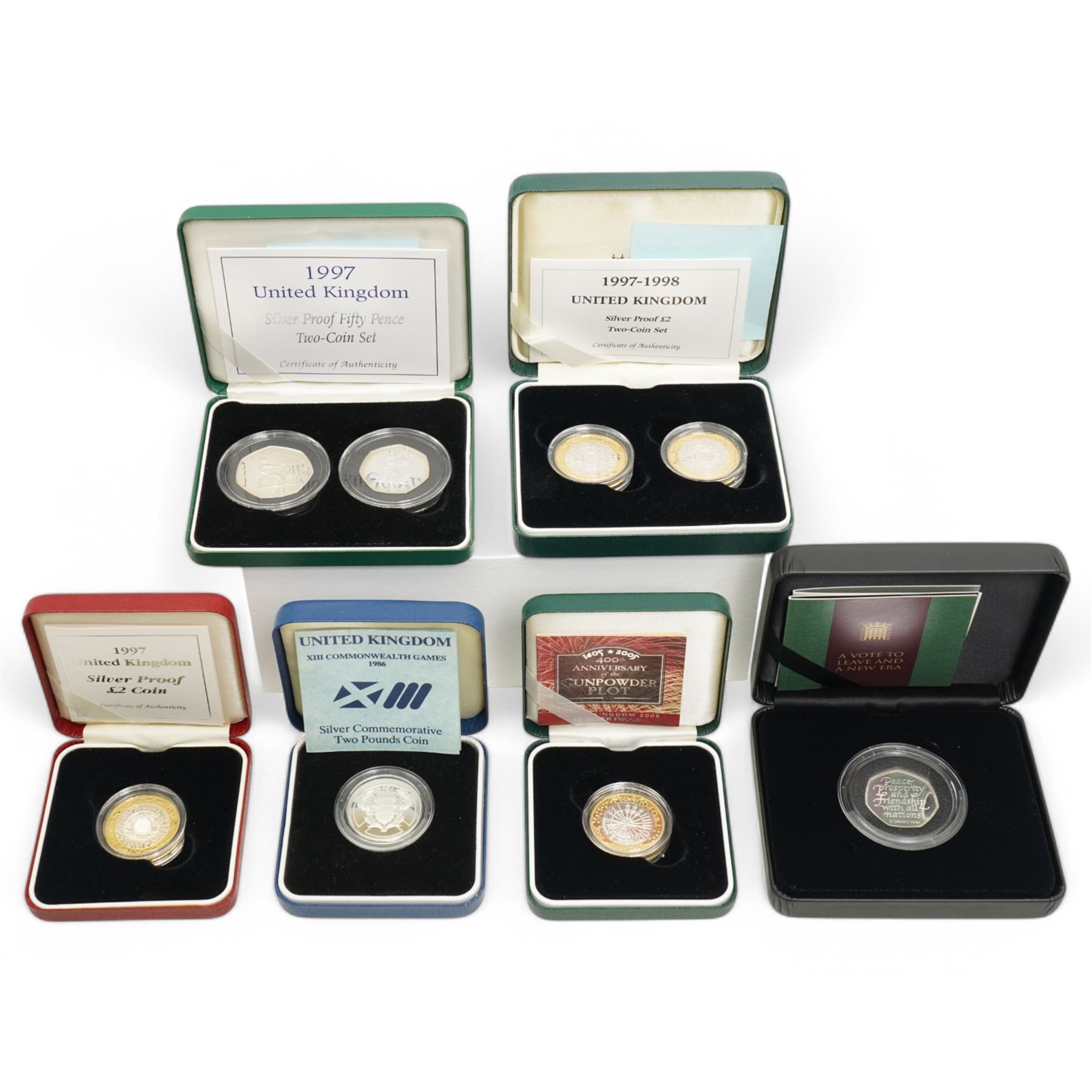 Six The Royal Mint United Kingdom silver proof coins or sets, comprising 1986 'XIII Commonwealth Games', 1997 two pounds, 1997 fifty pence two-coin set, 1997-1998 two pound two-coin set, 2005 '400th Anniversary of the Gunpowder Plot' fifty pence and 2020 'Withdrawal from the European Union' fifty pence, all cased with certificates