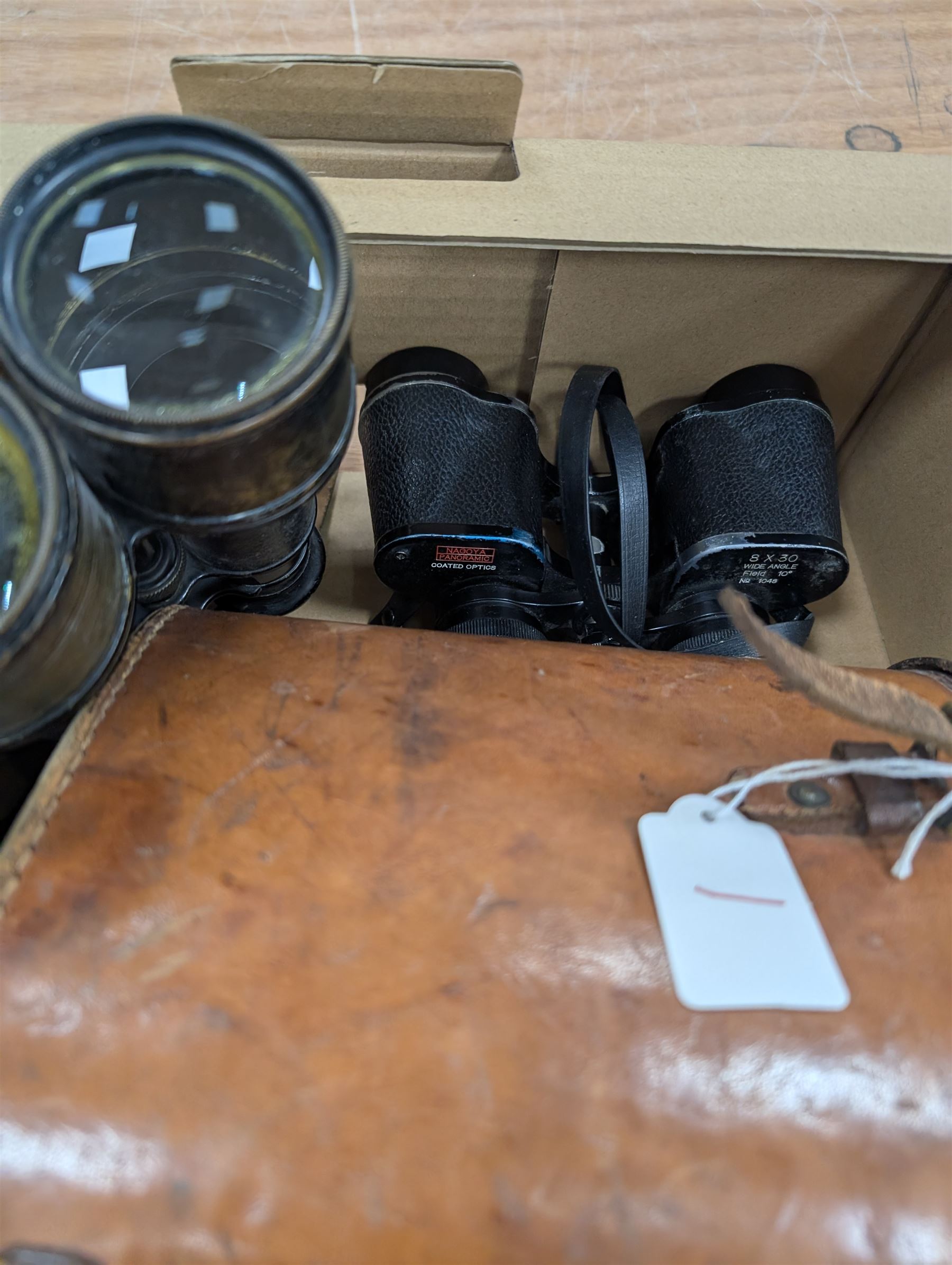 Nine pairs of early 20th century and later binoculars, including Tento 20x50, Nagoya Panoramic 8 x 30, Orr & Sons Madras, DRW 10 x 50, etc some with cases