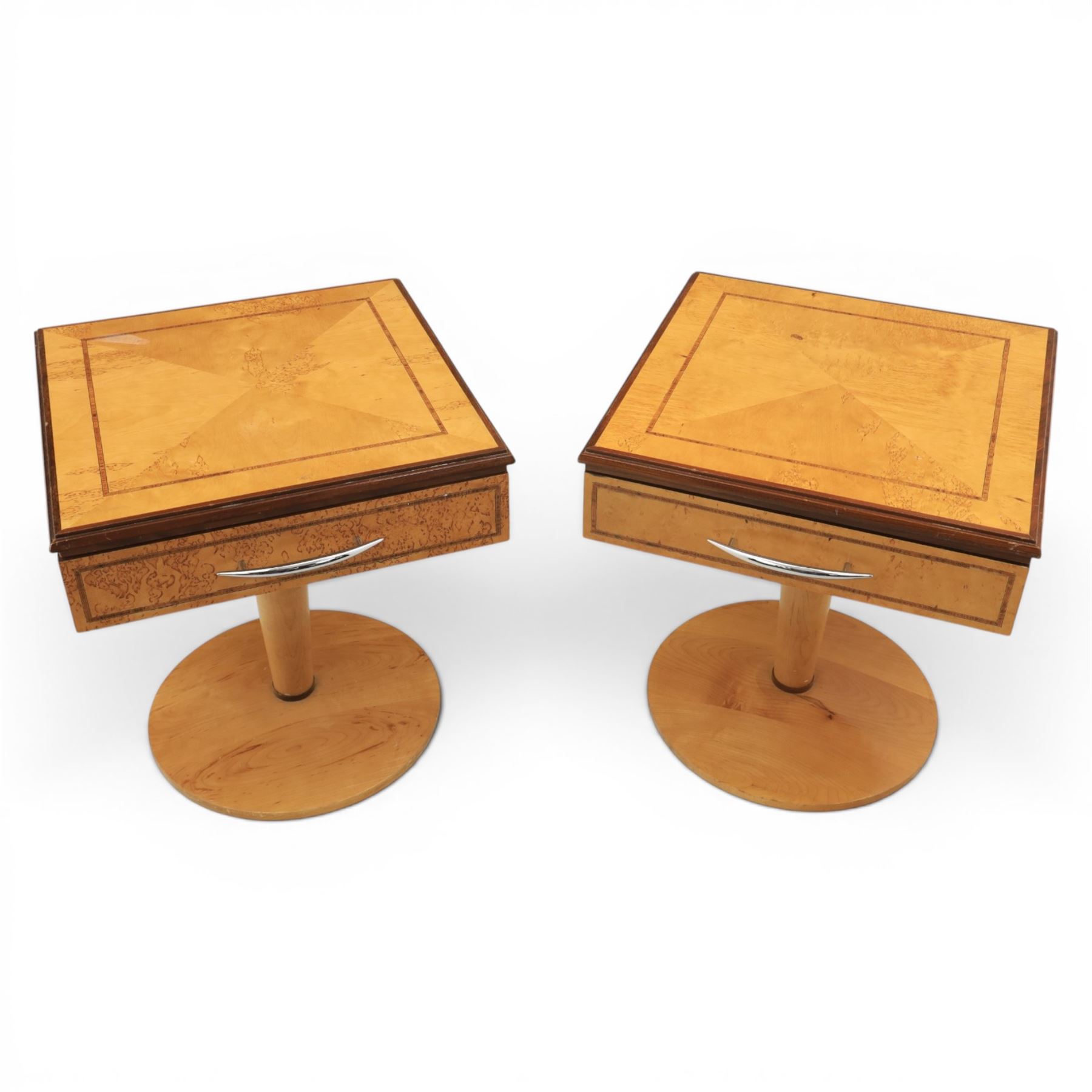 Art Deco style pair of walnut bedside tables, quarter matched veneered tops with crossbanded borders, fitted with single frieze drawers with chrome handles, on circular pedestal supports
