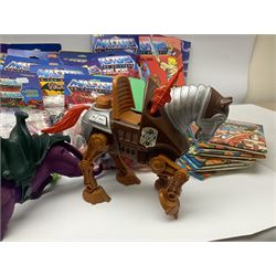 Thirty-one Masters of the Universe He-Man figures re-bagged on original backing cards;  two others lacking backing cards; boxed Modulok figure; bag of weapons and accessories; Roton, two horses and two battle cats; 1986 & 1987 Annuals; Ladybird and other story books; Panini sticker album; instructions etc