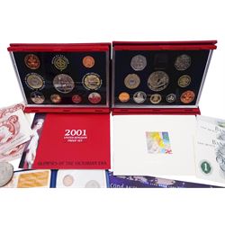 The Royal Mint United Kingdom 1998 and 2001 de-luxe proof sets both cased with certificates, 1999 'Millennium' five pound coin, two further five pound coins, 1995 two pound coin, commemorative crowns, two Bank of England one pound and two ten shillings notes, etc. 