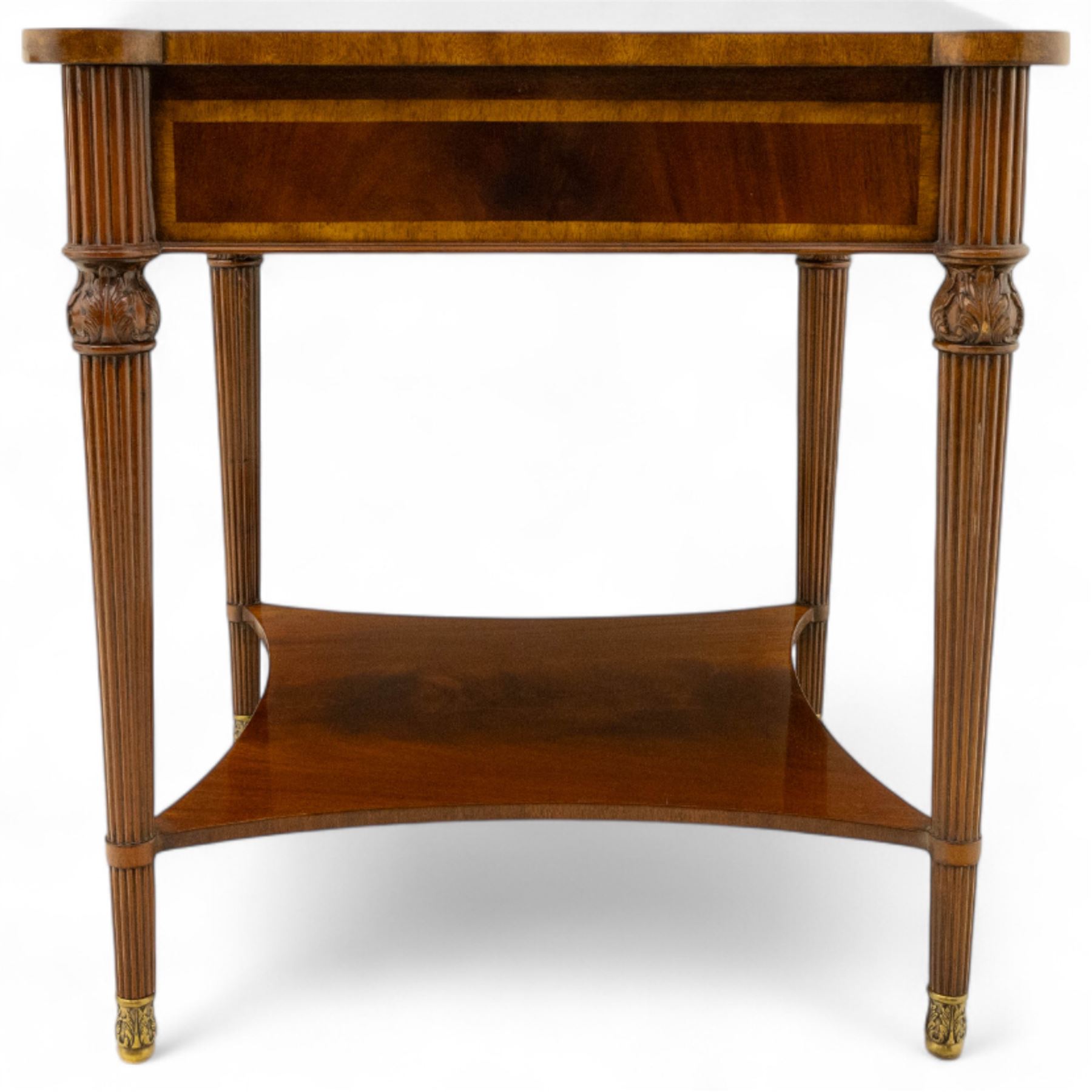 Maitland Smith - Pair of mahogany side tables, the rectangular top with rounded corners, the top edge inlaid with movingui wood, above two under-tier shelves, and frieze drawer, supported on stop-reed and acanthus foliate carved legs united by platform stretcher, raised on brass sabot foot caps