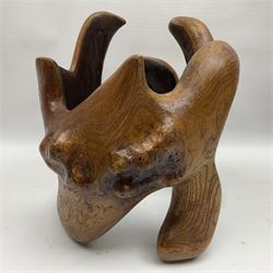 Helen Skelton (British 1933 – 2023): Two carved wooden abstract sculptures, one modelled as a entwined knot, largest H48cm. Born into an RAF family in 1933 in Kent and travelled the world extensively during her childhood. After settling in Bridlington, Helen immersed herself in painting, textiles, and wood sculpture, often inspired by nature's beauty. Her talent was showcased in a one-woman show at Sewerby Hall and recognised with the sculpture prize at Ferens Art Gallery in 2000. Sadly, Helen’s daughter passed away from cancer in 2005. This loss inspired Helen to donate her sculptures to Marie Curie upon her passing in 2023.