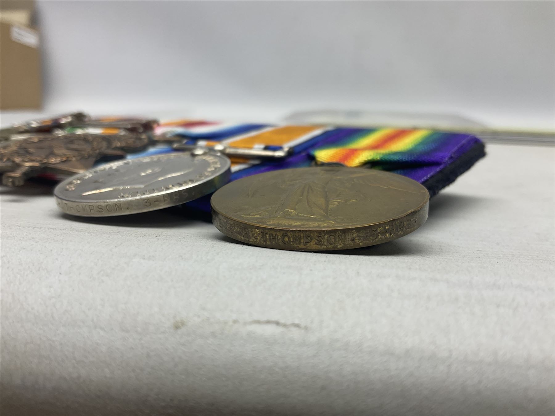 Boer War/WW1 group of five medals comprising Queens South Africa Medal with Transvaal clasp and Kings South Africa Medal with two clasps for South Africa 1901 & 1902 awarded to  2269 Pte. G. Thompson K.R.R.C.; together with British War Medal, 1914 Star and Victory Medal awarded to 6683 Pte. G.H. Thompson 3-HRS.; all with ribbons mounted for display on card; together with copy death certificate following discharge due to being physically unfit and other biographical photocopies.