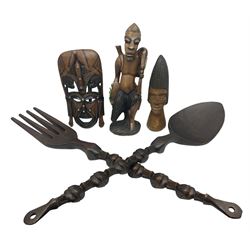 Native large carved large spoon and fork, the stems detailed with figures, together with two carved figures and mask, largest L100cm