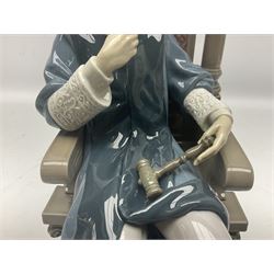 Lladro figure, Justice, modelled as a judge sat in a char, sculpted by Salvador Furió, with original box, no 5489, year issued 1988, year retired 1993, H34cm 
