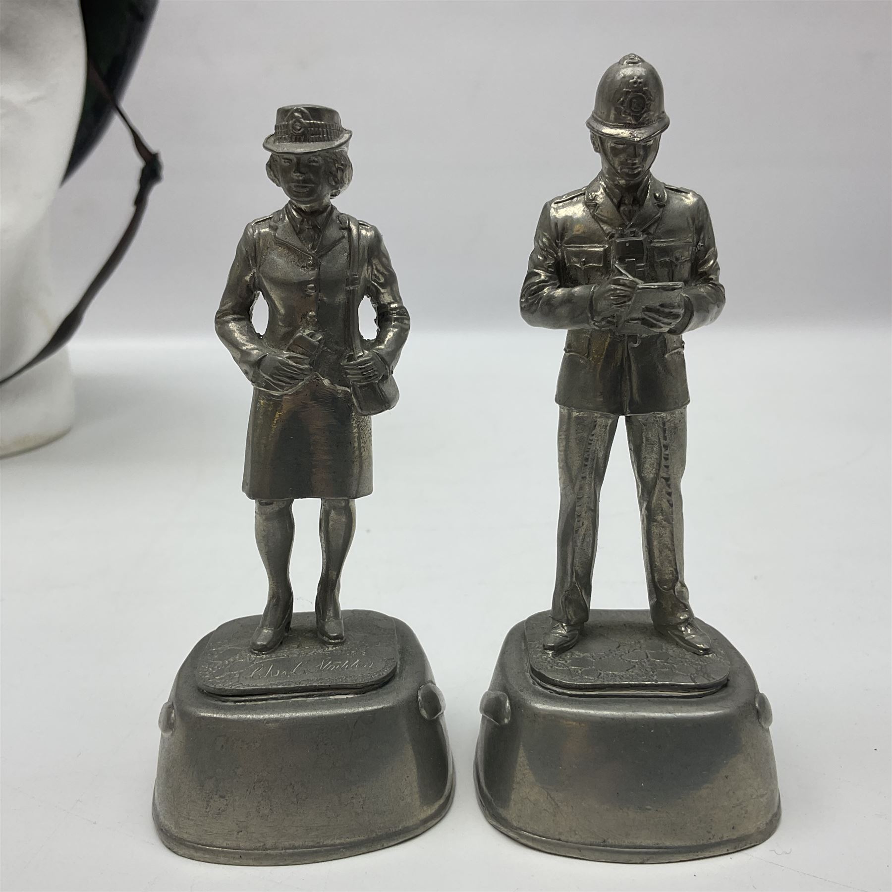 Police - Victorian turned hardwood truncheon with traces of decoration and VR cypher L42cm; Humberside Police helmet with Queens Crown helmet plate; hand lamp inscribed 'The Inspector'; and small pair of pewter figures of police officers (5)