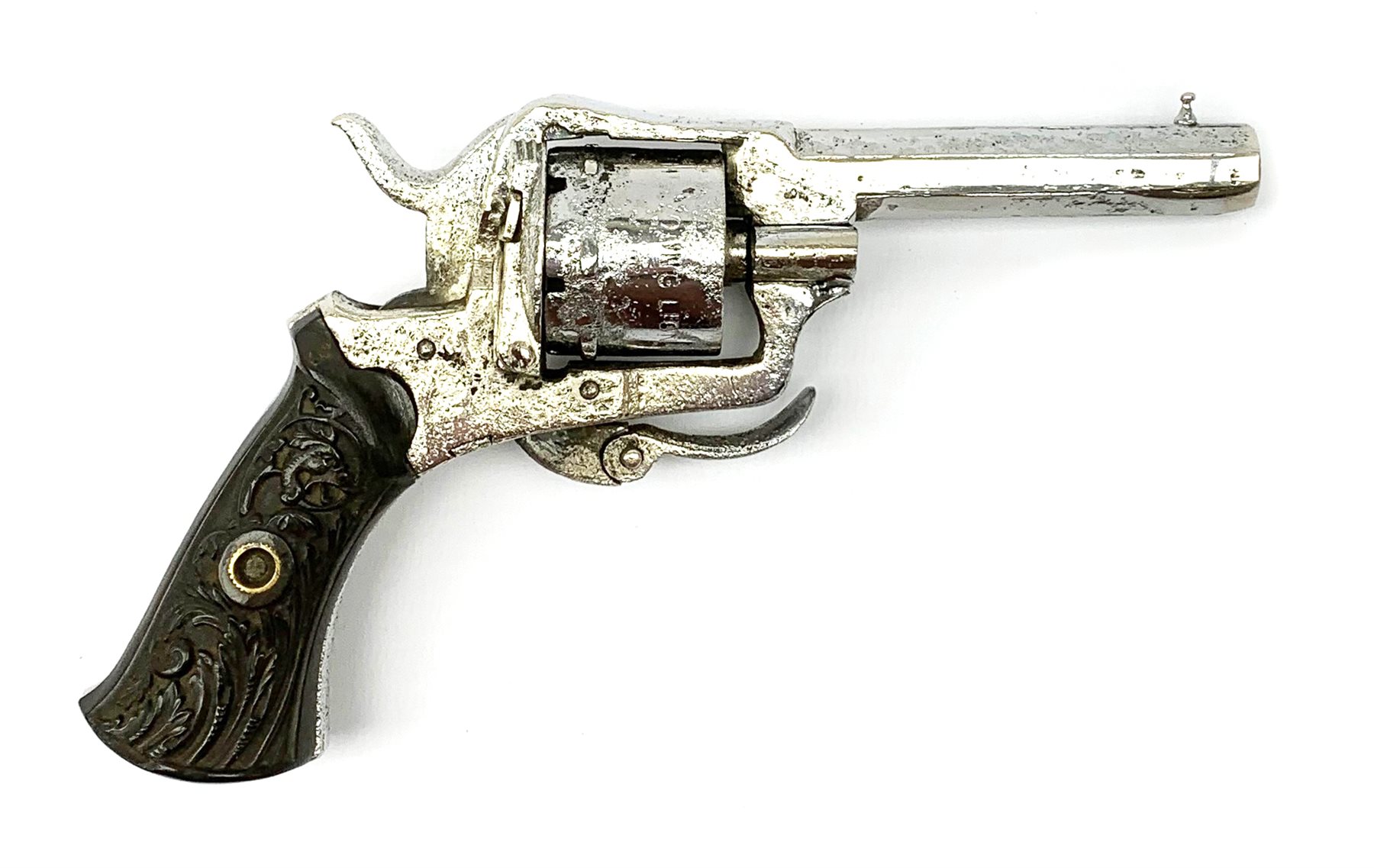 19th century plated Belgian 7mm pin-fire revolver, the six-shot cylinder inscribed 'The Young Lion 1881 New Pattern', with folding trigger and carved walnut split stock, barrel length 7.5cm, overall length 18.5cm