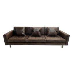 Ralph Lauren - three seat sofa, upholstered in buttoned brown leather with additional cushions, on turned brushed metal feet