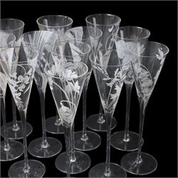 Twelve Crystal champagne glasses Les Fleurs, issued by the Franklin Mint in collaboration with Perrier Jouet, each glass is etched with a different flower, all boxed 