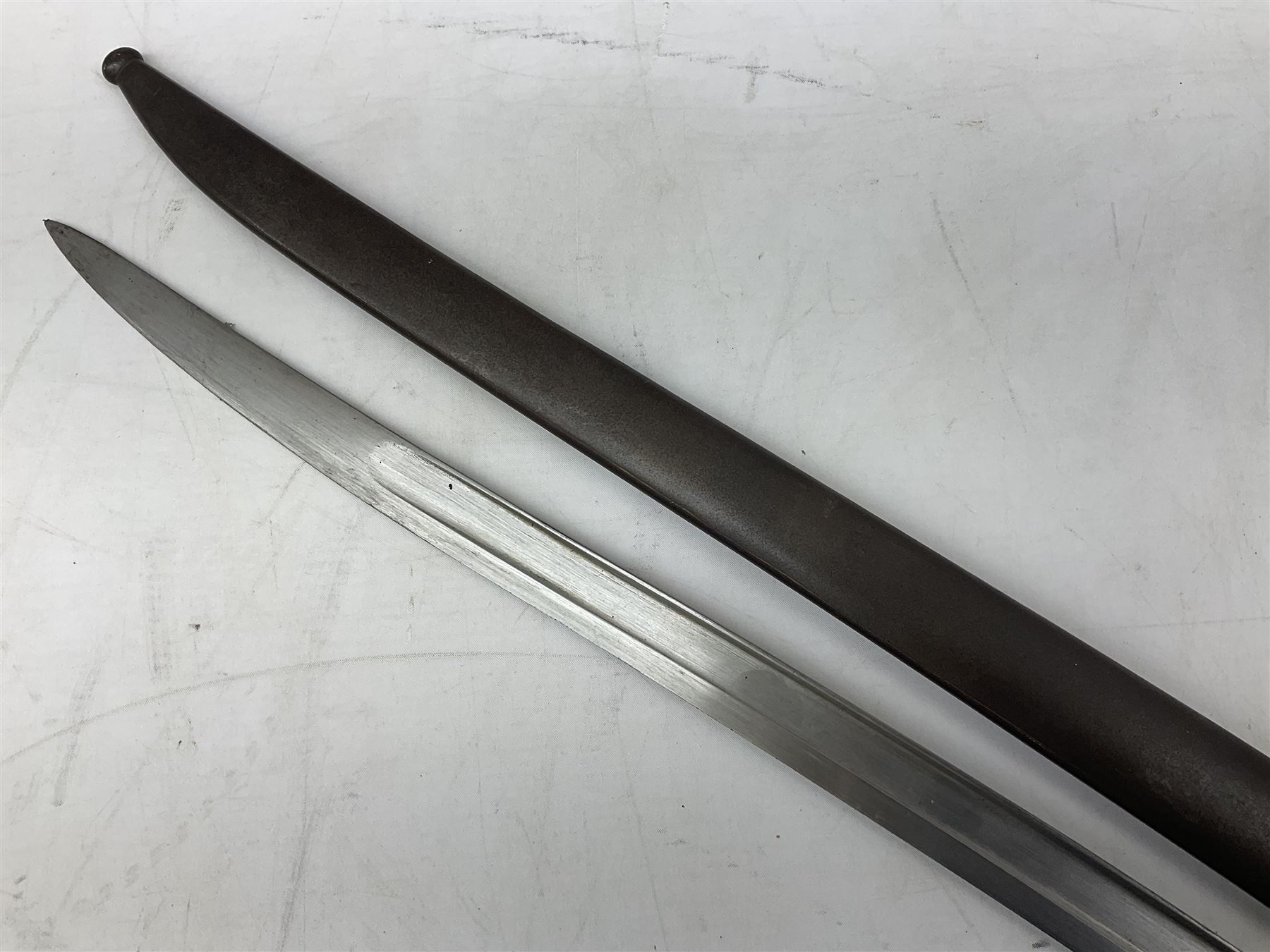 French model 1866 sabre bayonet, the 57.5cm curving blade marked St. Etienne 1868; in associated steel scabbard L71cm overall