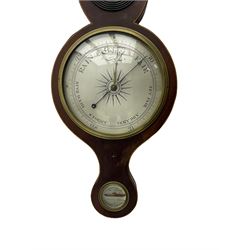 A mid Victorian mercury wheel barometer retailed by Thomas Grey of Newton Stewart, in a mahogany case with inlay to the edge, swans neck pediment and rounded base, with an 8” silvered register recording barometric air pressure from 28 to 31 inches with weather predictions, brass recording hand and steel indicating hand within a convex glass and cast brass bezel, silvered “butlers” mirror with reeded wooden surround and a round topped thermometer box with a mercury thermometer measuring degrees Fahrenheit, level bubble with silvered nameplate. H96cm
.

