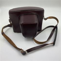 Leitz Leicaflex SL2 camera body, serial no.1387046, with 'Summicron-R 1:2/50 Leitz Wetzlar' lens, serial no. 2273397, within a leather Leitz lens hood 