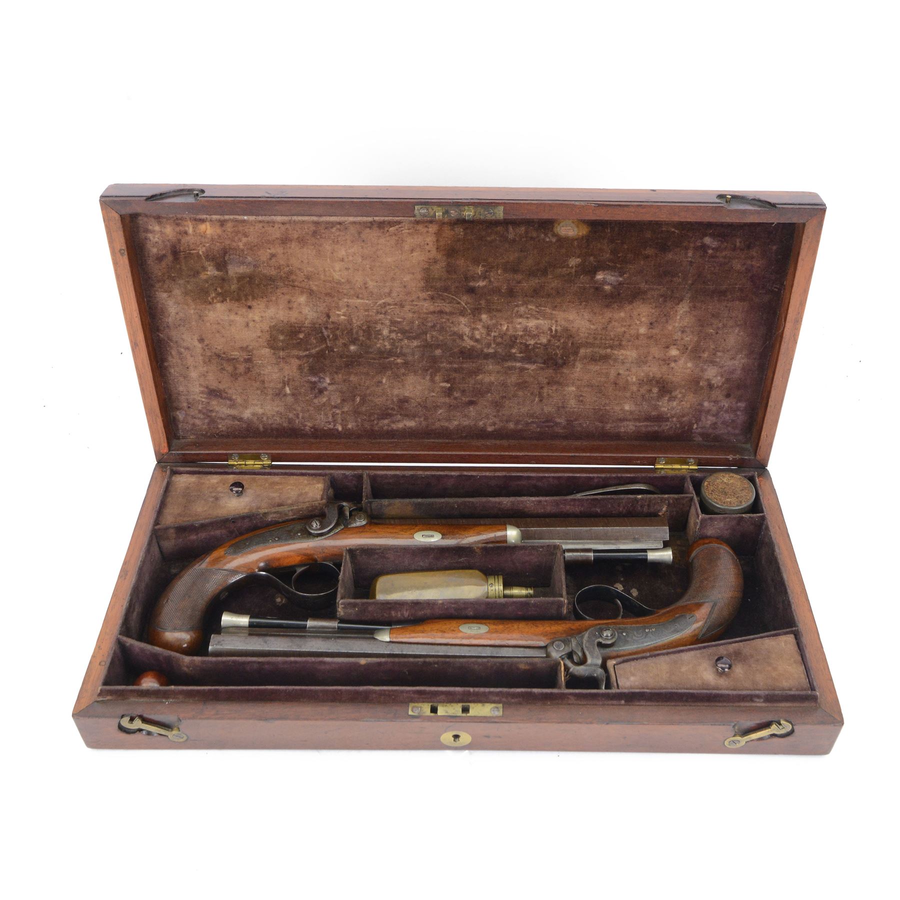 Pair of 19th century officer's duelling pistols, by William Chance & Son, with 25 bore sighted octagonal brown barrels, engraved London to the top, with gilt and platinum lines, foliate engraved tang, the back action lock plate signed and engraved with foliage, the walnut half stock, the trigger guard engraved with foliate and pineapple design, with ebony ramrods, in a brown velvet lined mahogany case, fitted with accessories including a copper pistol flask, a steel bullet mould, a tin of caps, lead balls, a cleaning rod with brass screw top