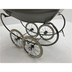 Silver Cross coach-built doll's pram with green fold-down hood and cover, sprung tubular frame, chrome and white handle, four spoked wheels with brake, mattress, pillow and bedding L97cm