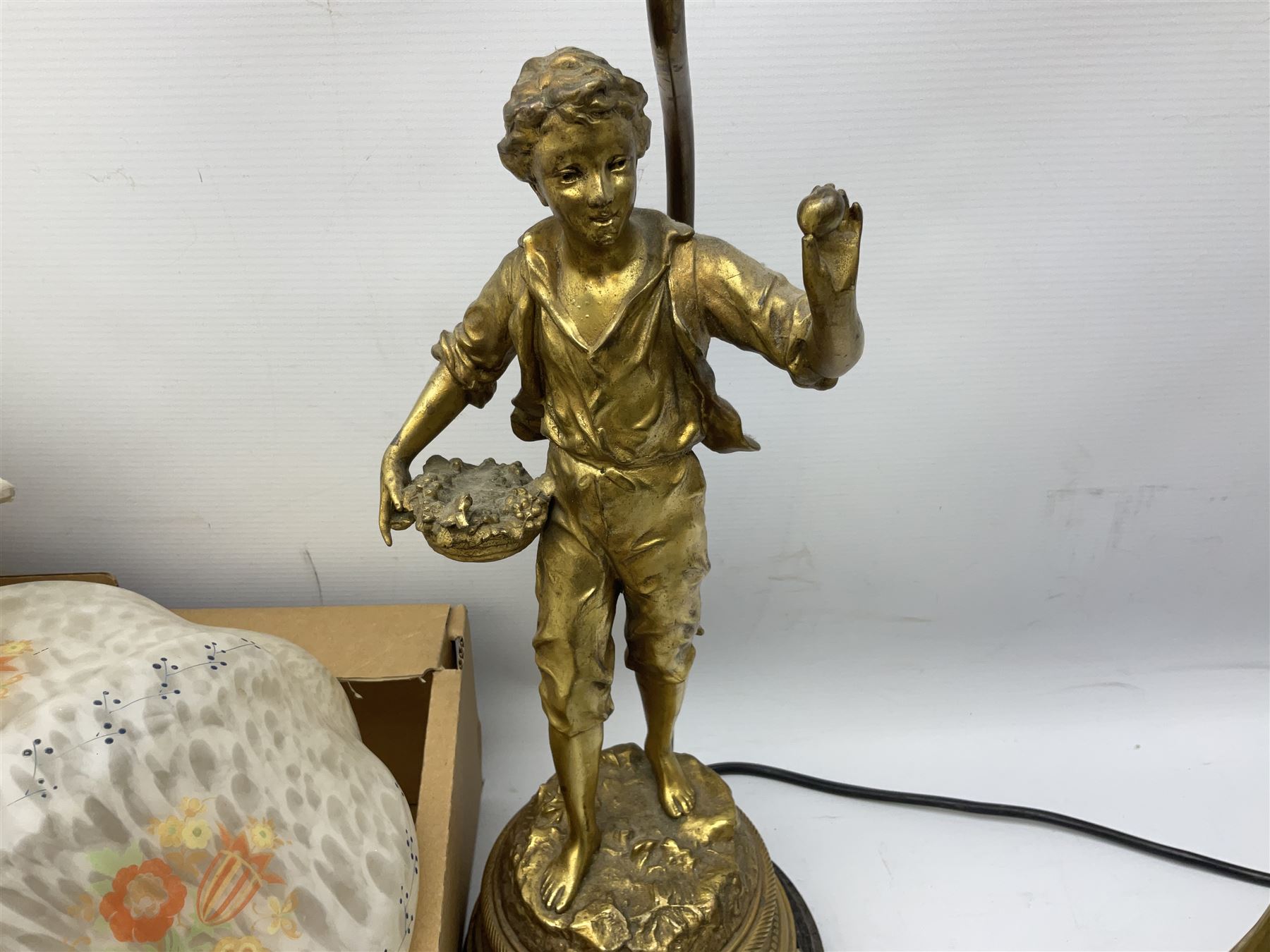 Brassed lamp modelled as a male with basket and fruit after Rancoulet, Tiffany style table lamp, brass table lamp, glass shades etc
