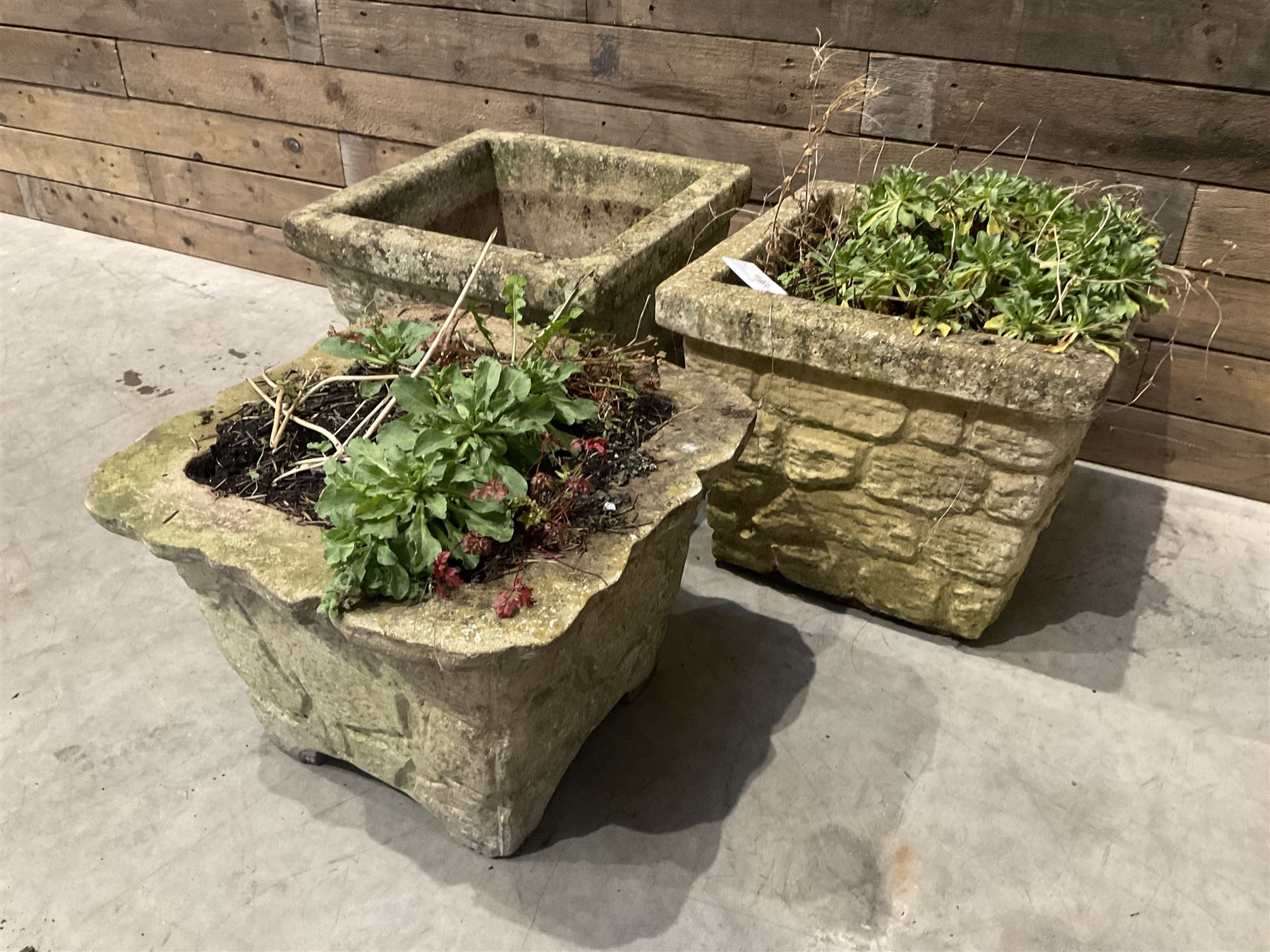 Pair of cast stone pattern tapering square planters, and a similar planter (3)