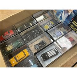 Fabbri James Bond Collection - over one hundred and ten die-cast models in perspex display cases as issued periodically; and a quantity of associated magazines and trading cards, in five boxes