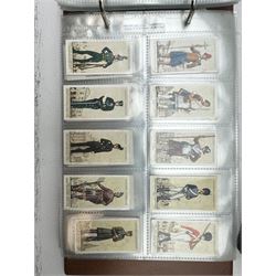 Album of Players militaria related cigarette cards, including Colonial & Indian Army Badges, Military Uniforms of the British Empire overseas, War Decorations & Medals etc, together with nine mounted cigarette cards 