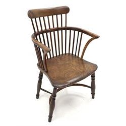 Early 19th century elm and yew wood Thames Valley comb back armchair, dished elm seat, turned supports jointed by crinoline stretcher, W54cm, seat height - 41cm