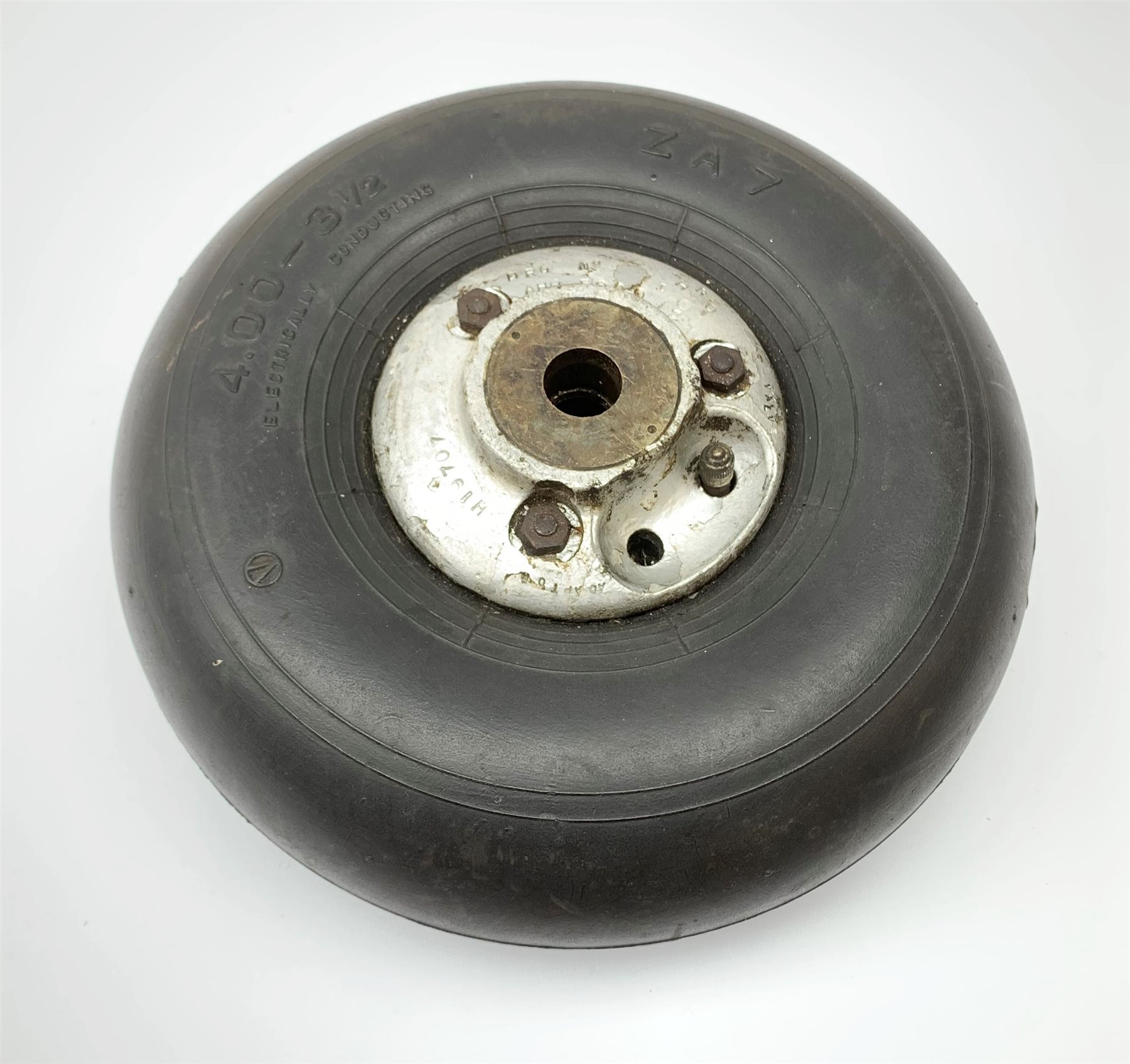 WWII Spitfire/Hurricane pneumatic '4.00 x 3 1/2' tail wheel, aluminium hub with various stamped marks inc. DRG No.AHO5000, brass bushes dia. 26cm