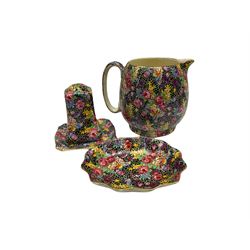 Ten pieces of Grimwades 'Hazel' pattern chintz ware, comprising teapot, jug, smaller jug, dishes of various size and form, teacup and saucer, sugar sifter, and pepperette 