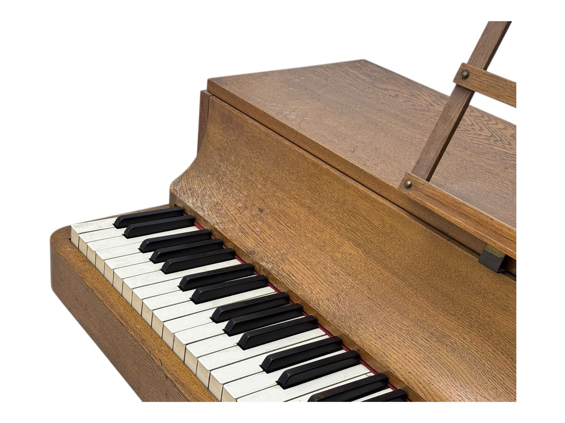 Louis Zwicki - mid-20th century oak cased compact piano, fitted with a folding music rest and full keyboard, dual brass pedals