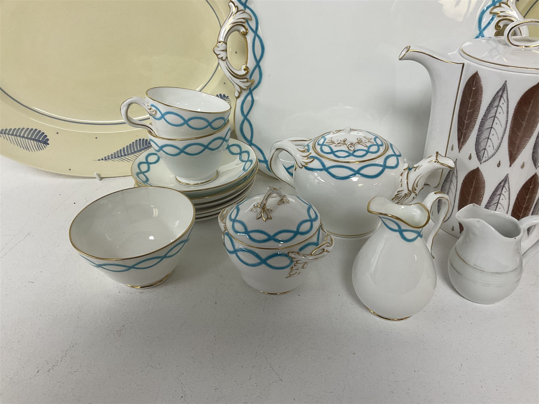 Victorian cabaret set,  comprising teapot, milk jug, covered sucrier, open sucrier, two cups and saucers upon a tray, together with Susie Cooper Hyde Park pattern coffee set, comprising coffee pot, four coffee cans and saucers, dessert plates and three plates in a similar design 