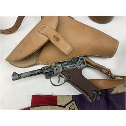 George VI 1937 Coronation flag, the central portrait and date covered with stitched panels 56 x 83cm; sailor's hat; leather holster with belt dated 1943 containing Lone Star toy die-cast Luger gun; and reproduction Stanley brass cased pocket sextant (4)