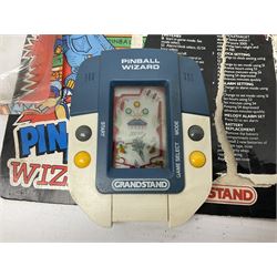 Collection of retro handheld games, including Nintendo Game & Watch ‘Snoopy Tennis’ (1982) and ‘Squish’ (1986) both with instruction booklets, Casio CG-600 ‘Star Invader’ with box, 3 in 1 LCD cartridge game including ‘Soccer’, ‘Invader’ and ‘Bomb Finder’ games, and two Grandstand ‘Pinball Wizard’ (1988) games, both with original boxes