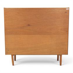 Jentique - mid-20th century teak highboard, fall front cabinet next to a sliding door cupboard above and open recess, the lower section with cabinet doors and three graduated drawers, raised on cylindrical legs