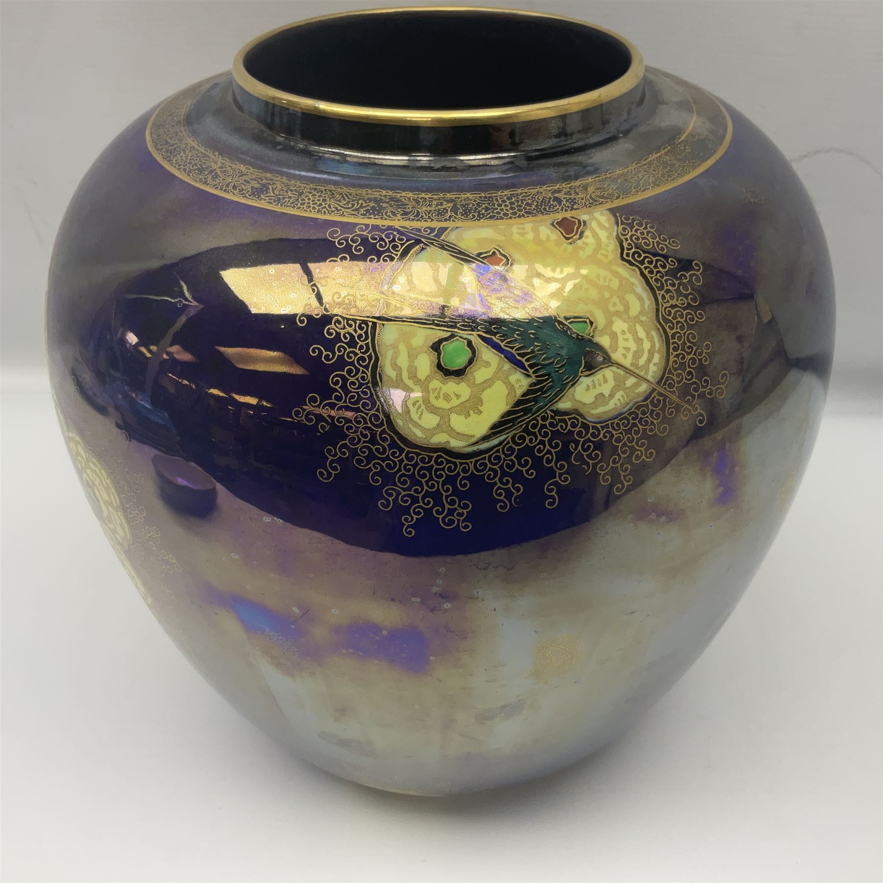 Carlton Ware lustre ginger jar and cover decorated with birds in flight on a blue ground, H32cm