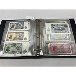 World banknotes, including Queen Elizabeth II The States of Jersey one pound 'DB202703', five pounds 'BB527762' and ten pounds 'AB651481', reserve bank of New Zealand two dollars '1L3 741894', King George V Straits Settlements one dollar 1st January 1935 'F/83 28924', various Bank of England notes etc, housed in two ring binder albums
