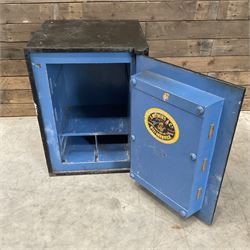 Samuel Withers & Co of West Bromwich - Victorian cast iron safe, the brass handle modelled as a clenched fist, painted in red, orange and black, with key. Ground floor delivery only, no steps.